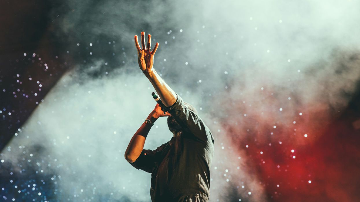 man singing on stage