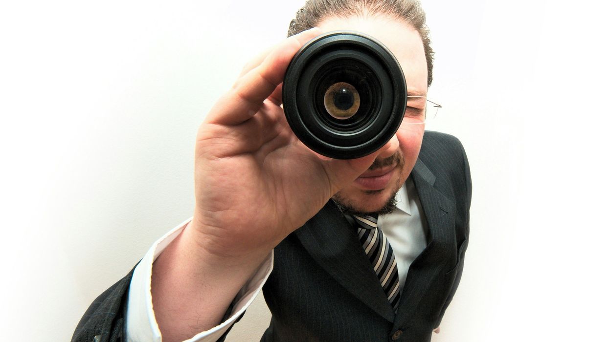 Man using a monocular