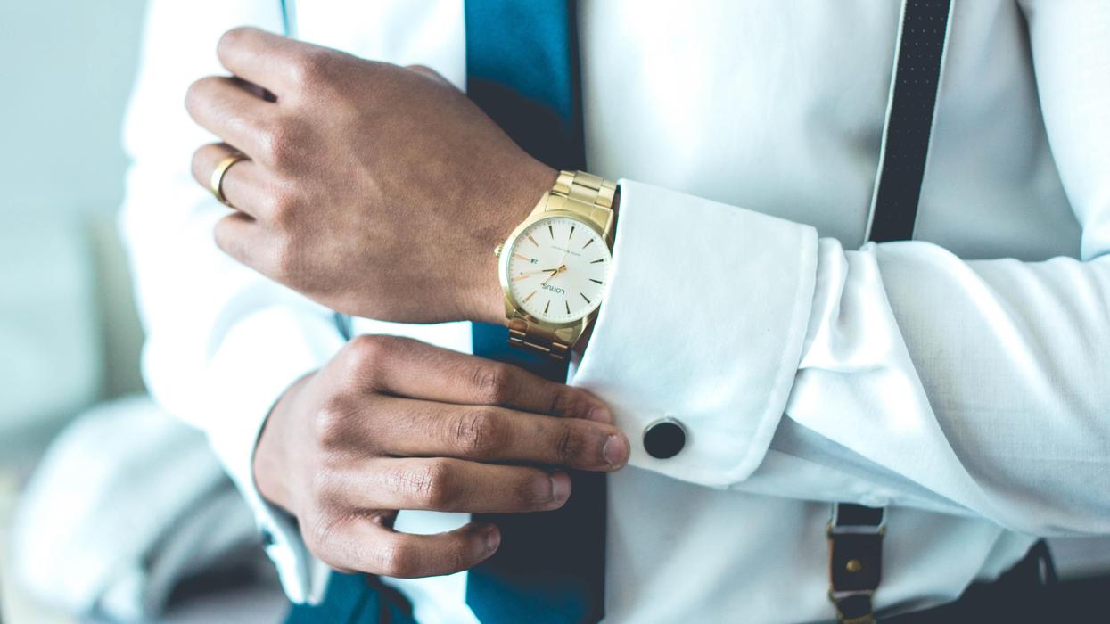 Man wearing white dress shirt and luxury watch