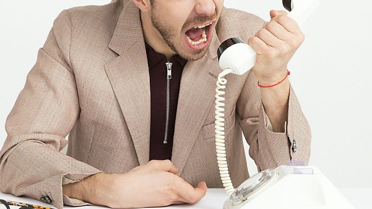 Man yelling into phone