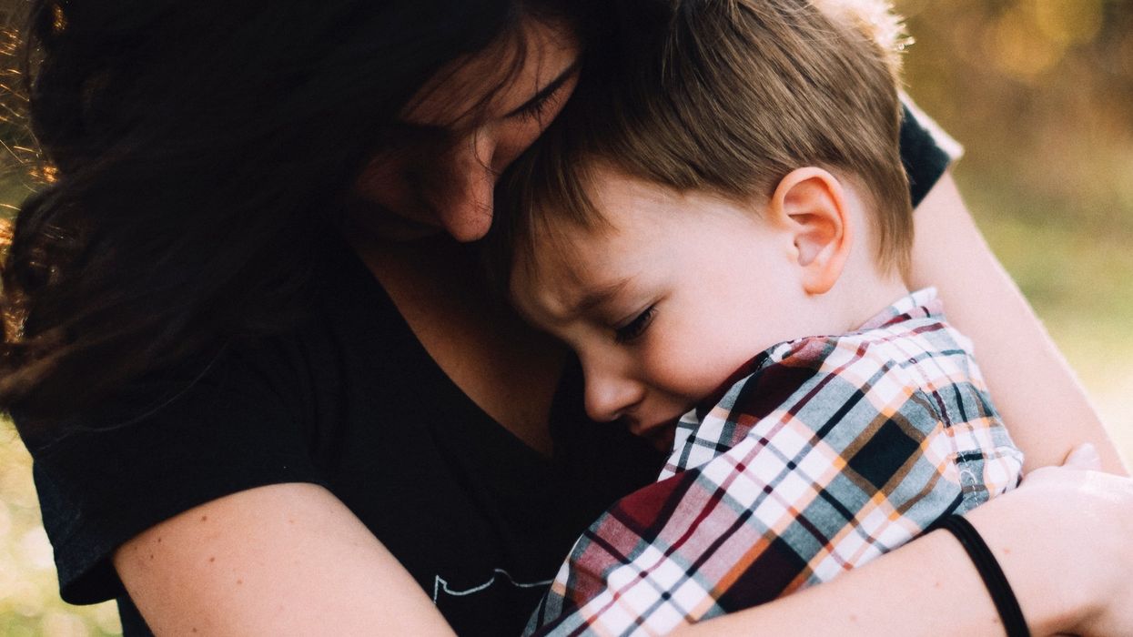 Mother comforting her son