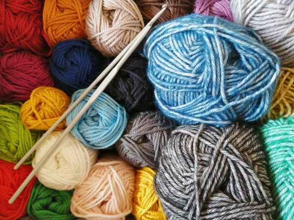 multiple skeins of yarn in a variety of colors