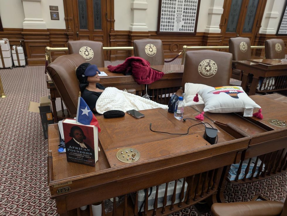 Nicole Collier asleep in the Texas Capitol