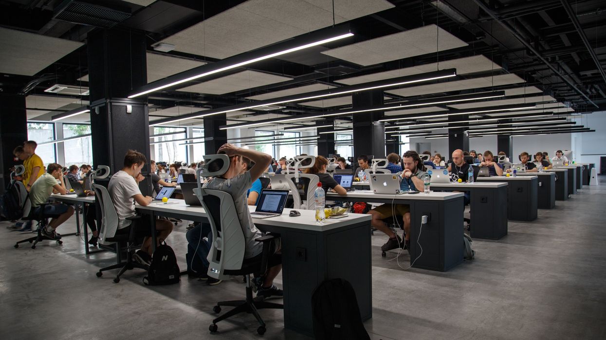 office full of desks and workers