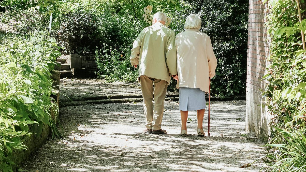 older couple walking on path