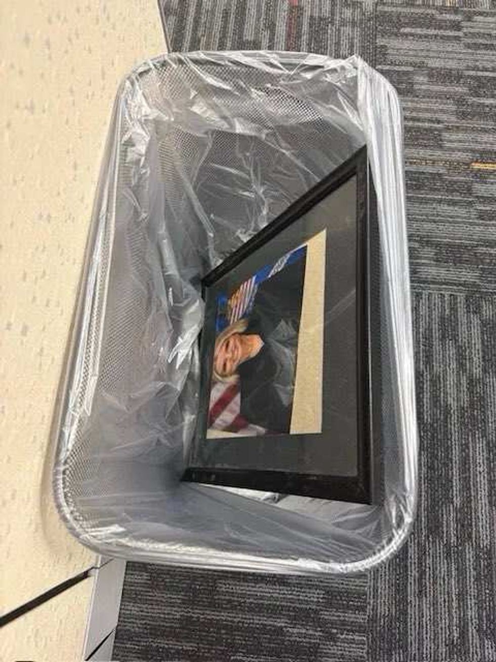Pam Bondi's DOJ portrait in the trash
