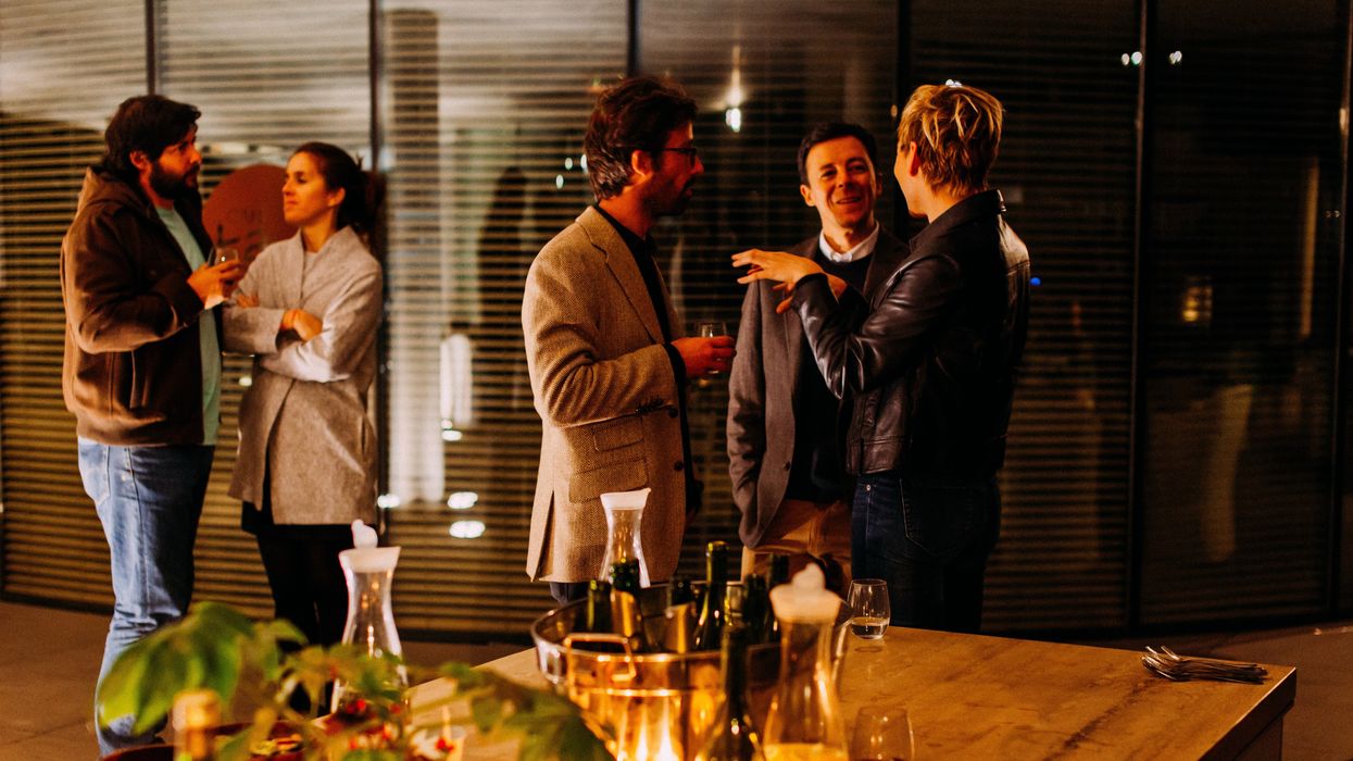 People catching up at reunion event