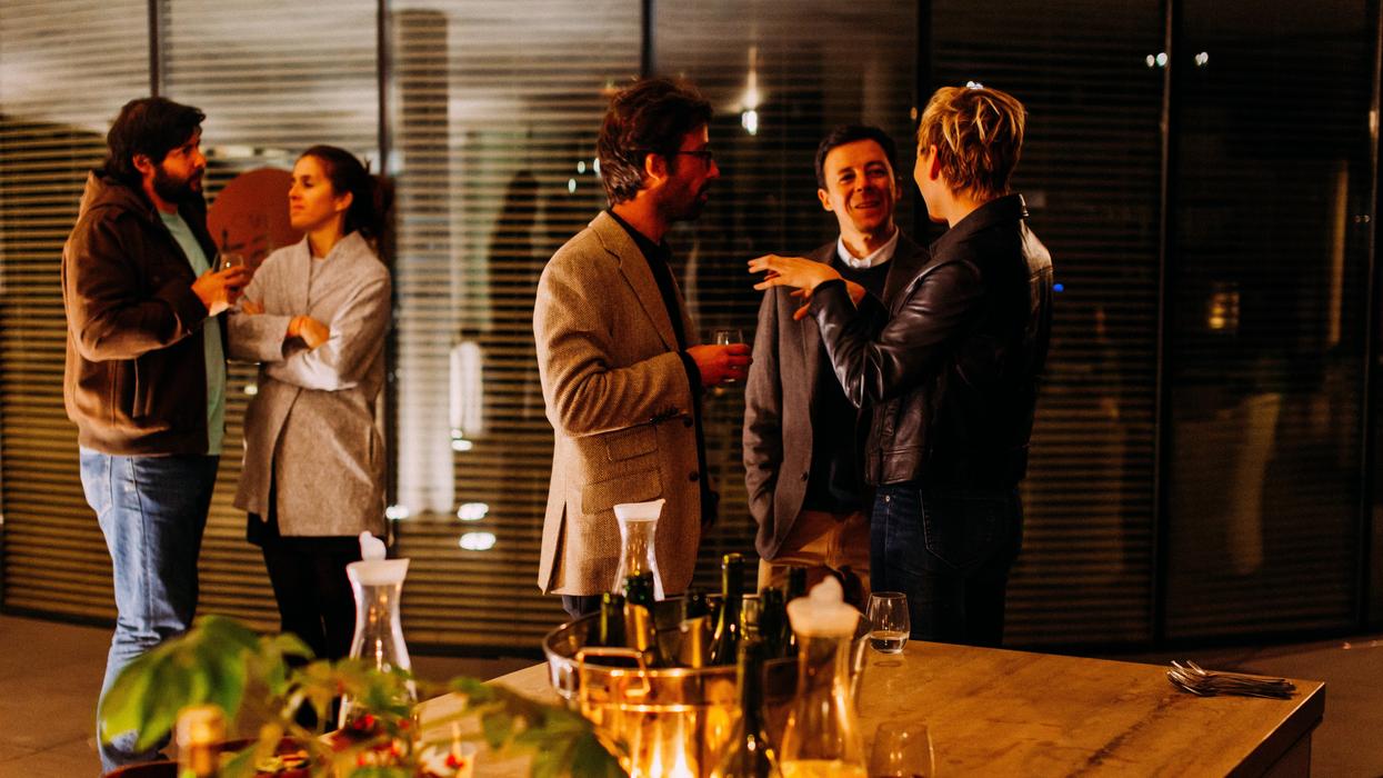 People catching up at reunion event
