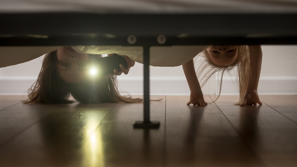 People checking under the bed