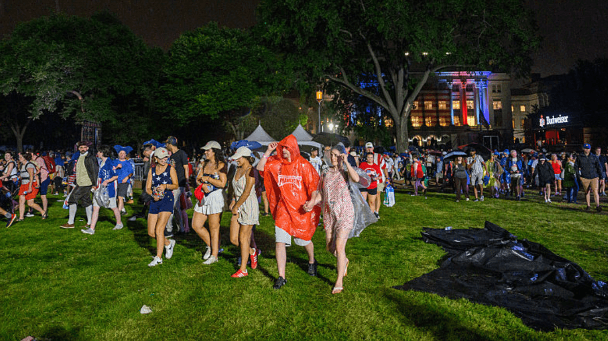 People leaving Great American State Fair during rainfall
