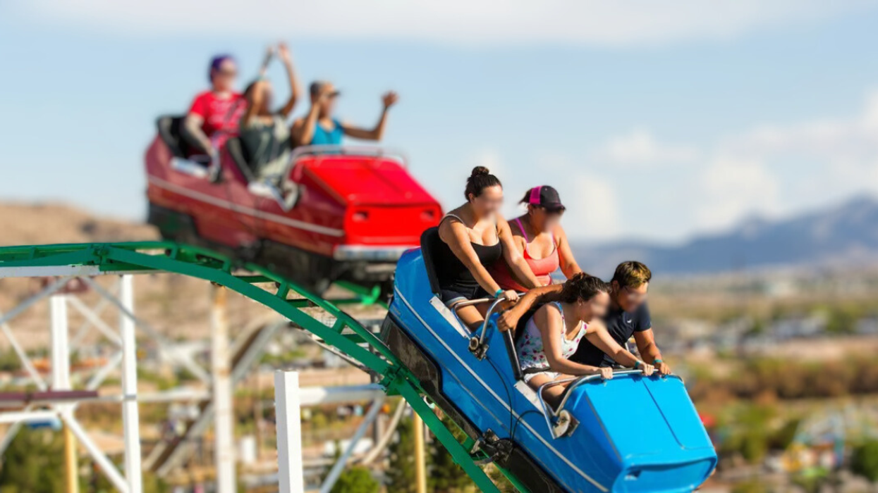 people riding a roller coaster