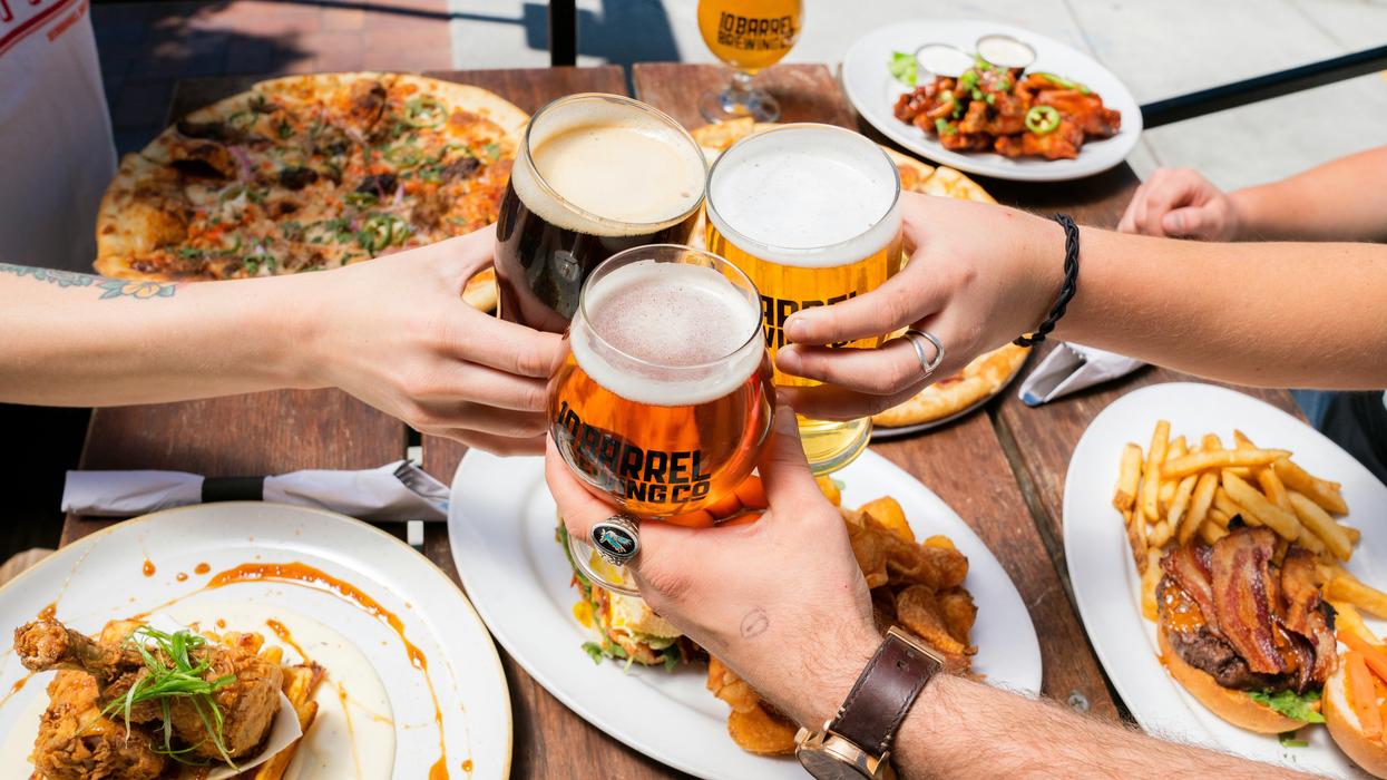 people toasting with beer