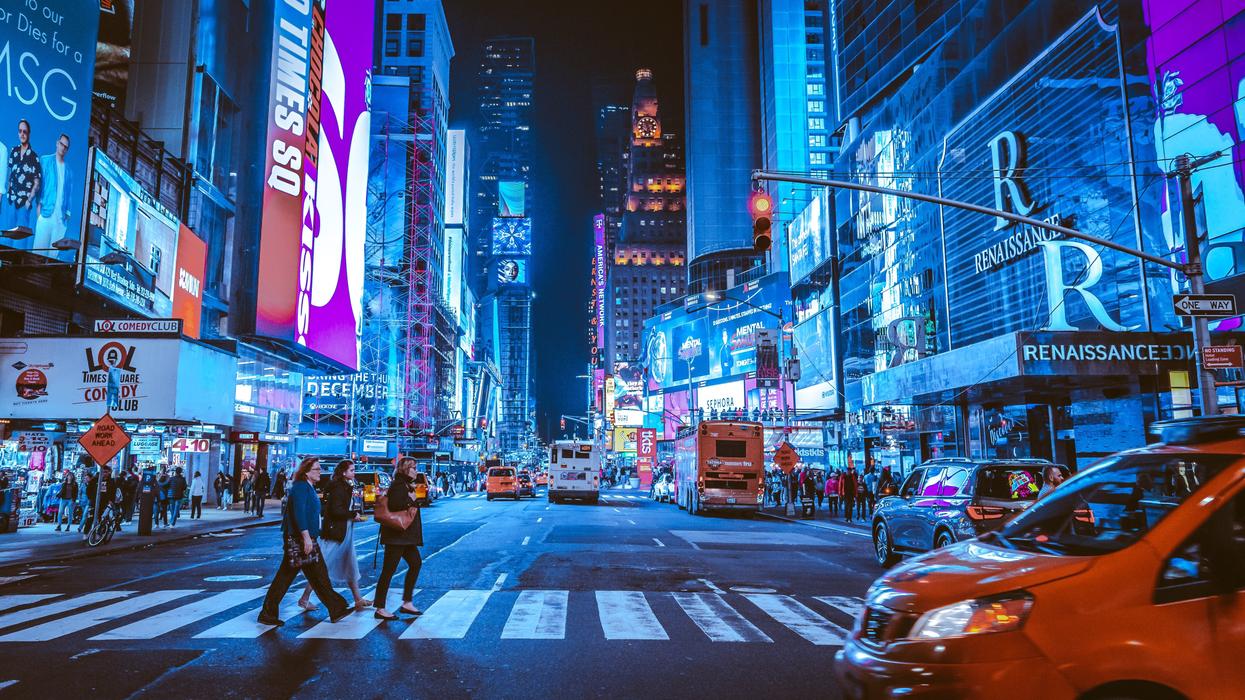 people walking on pedestrian lane during night time