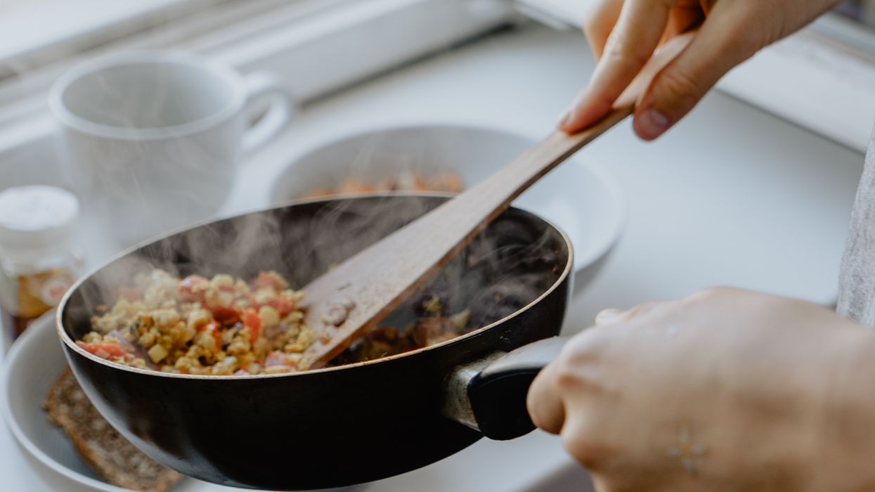 Person cooking a scrambled tofu dish