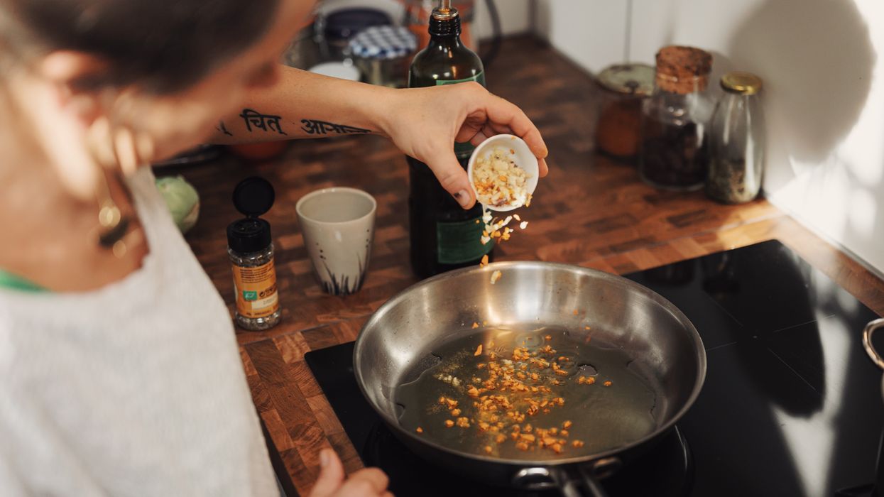 Person cooking in home kitchen