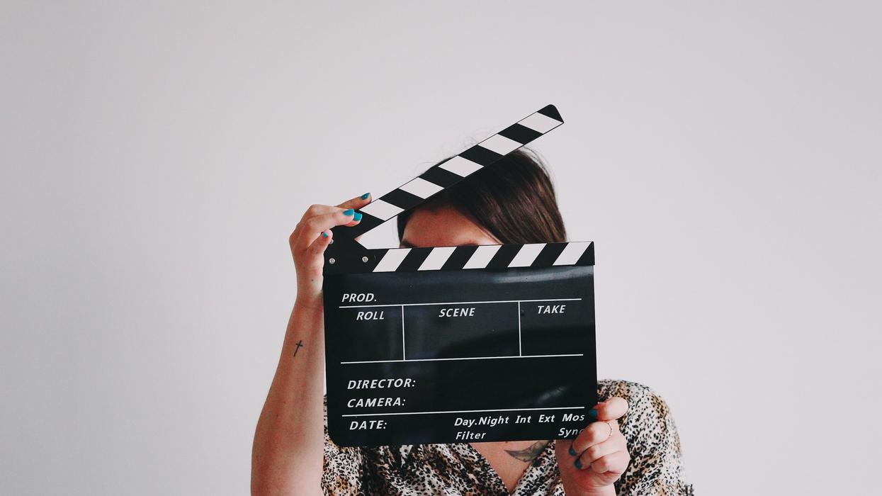 Person holding a movie clap board