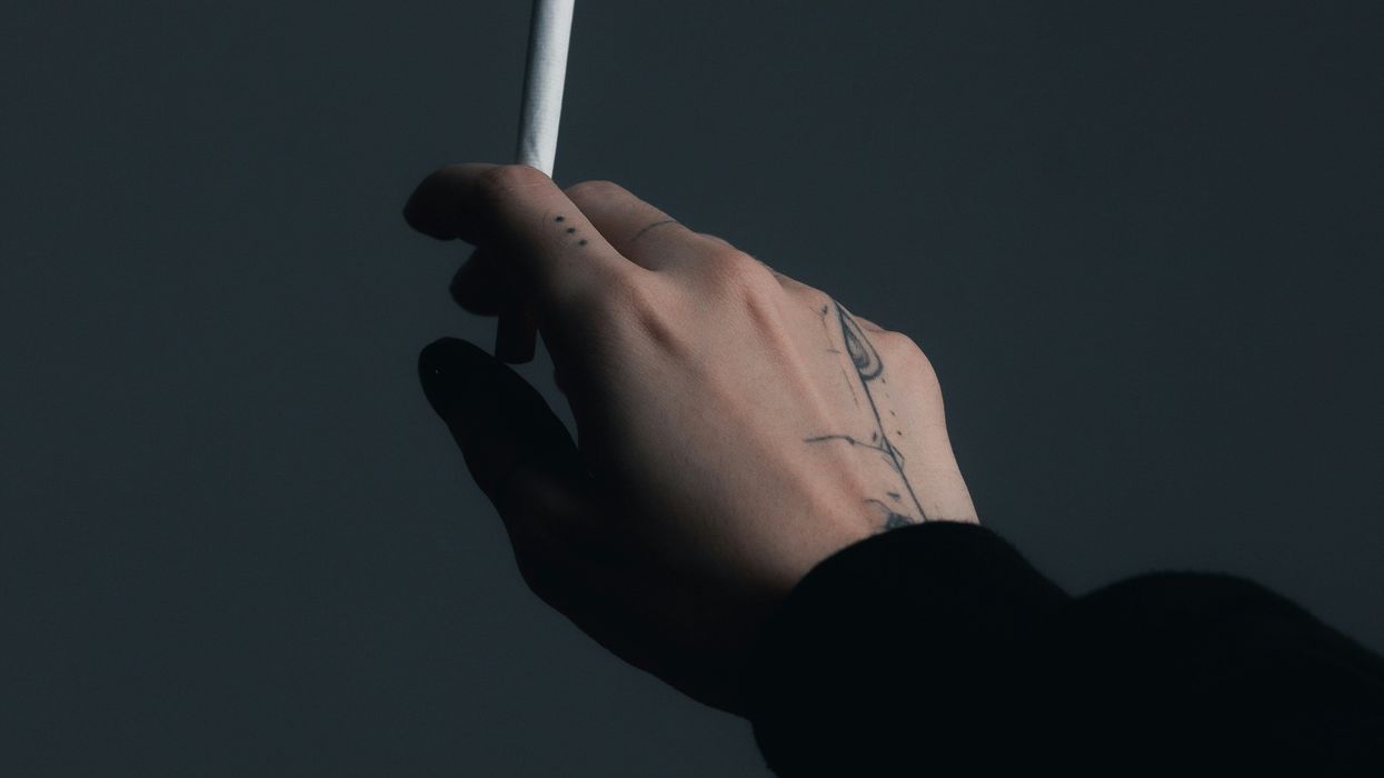 Person holding cigarette