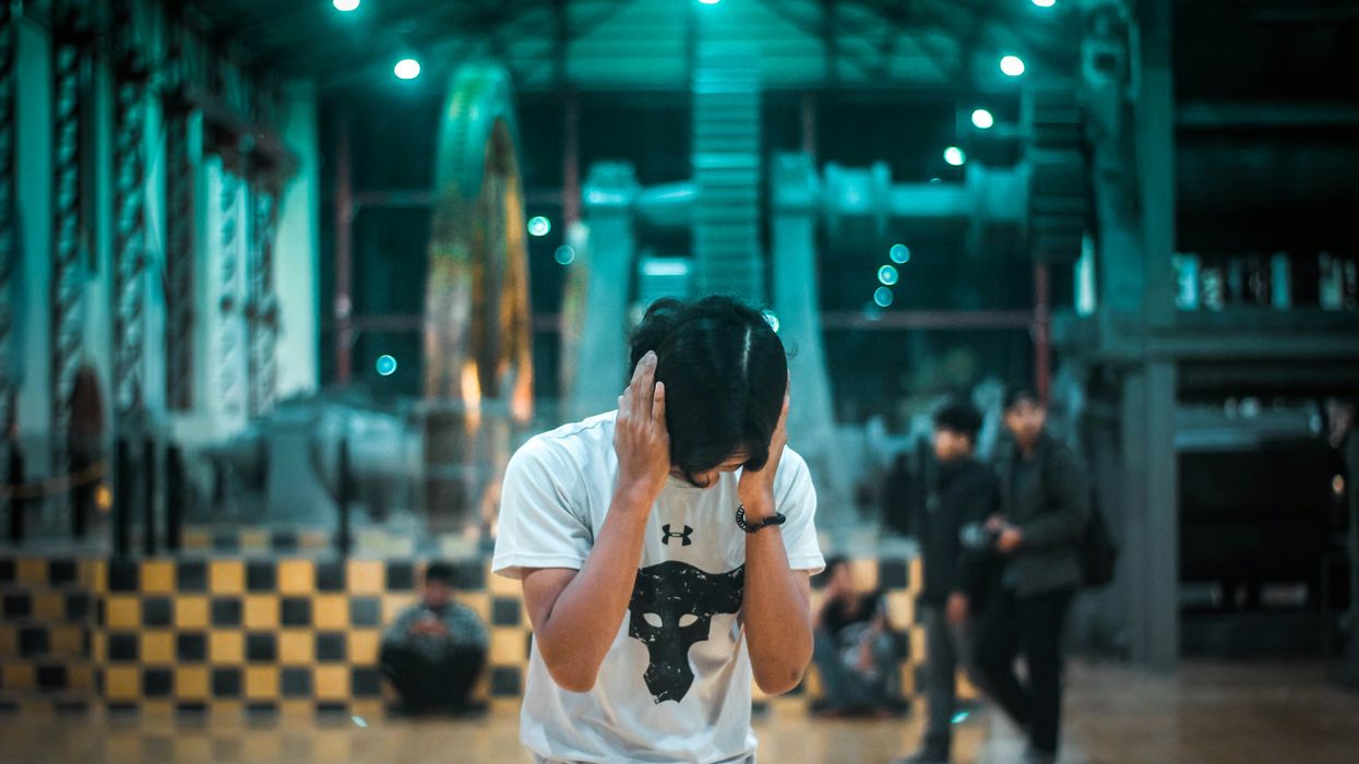 person in public covering their ears