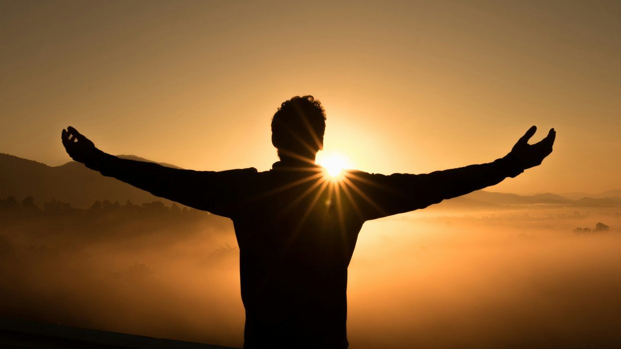 Person raising their hands in excitement