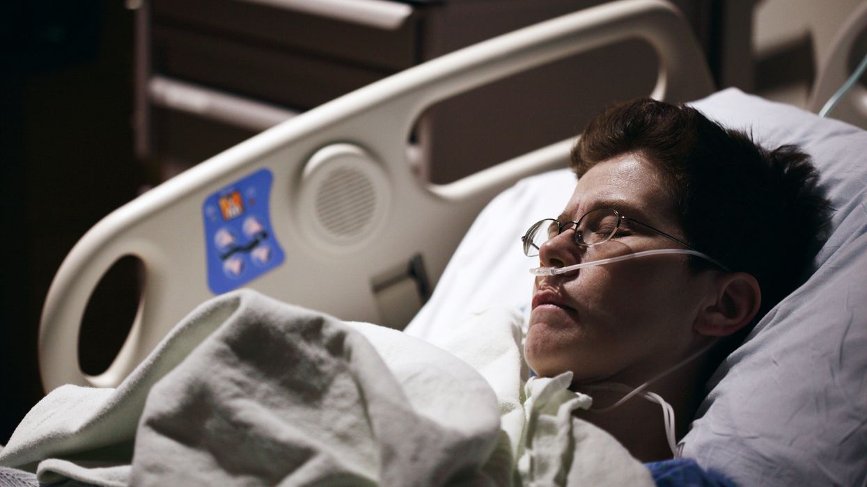 Person resting in a hospital bed