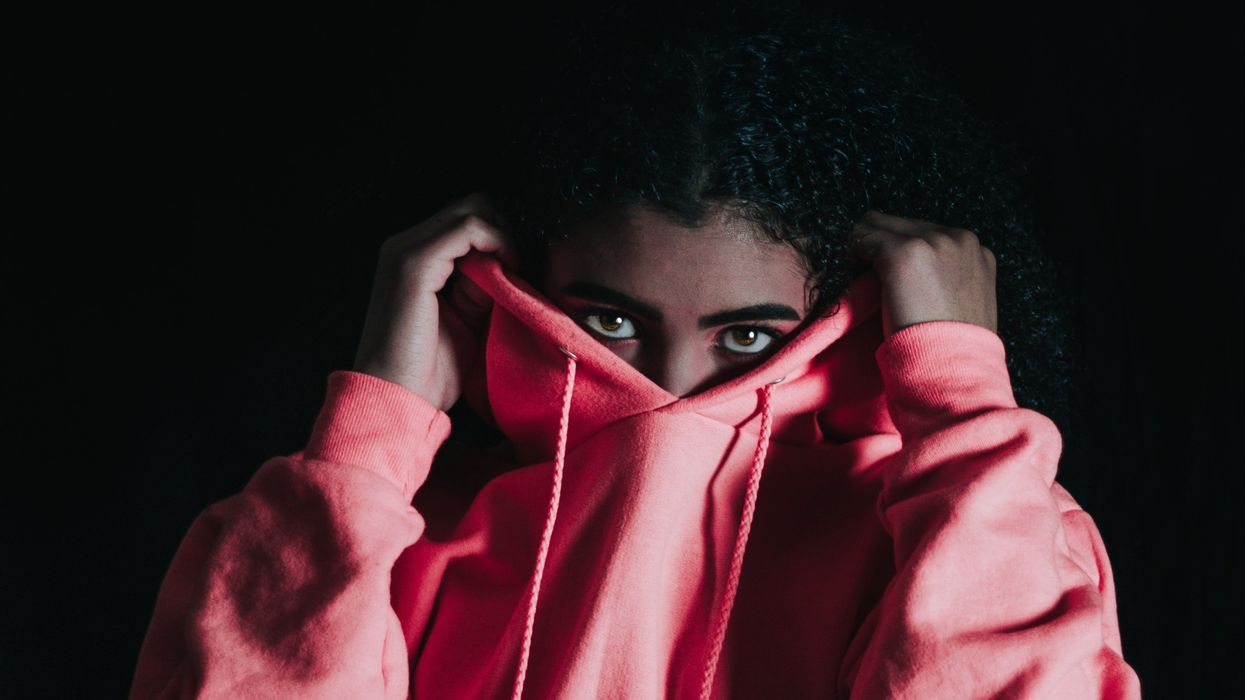 Person retreating into their hoodie for comfort