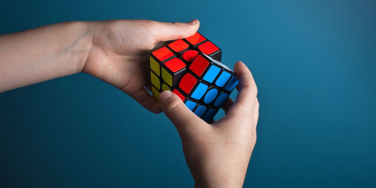 Person solving a Rubik's cube