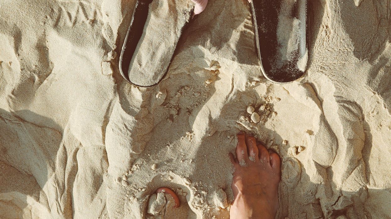 person standing on sand