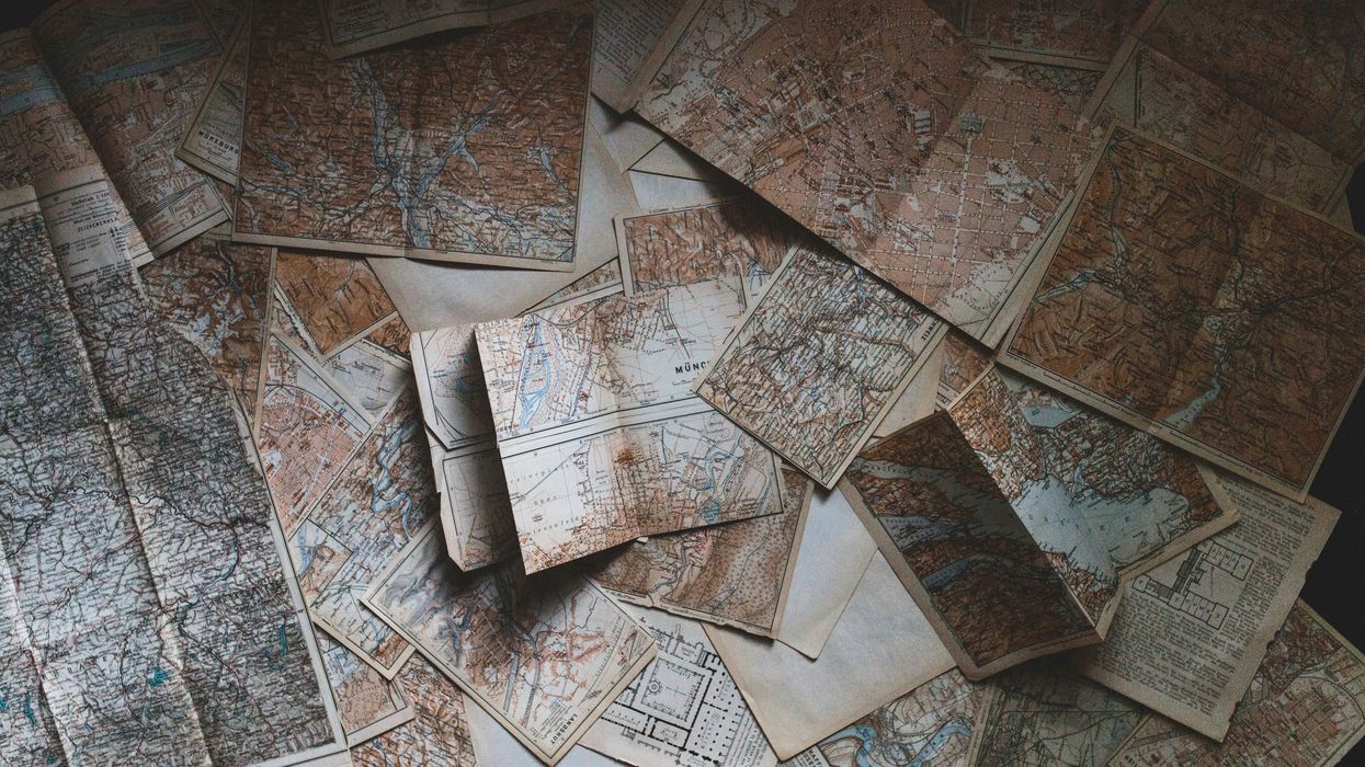 Person studying a series of maps