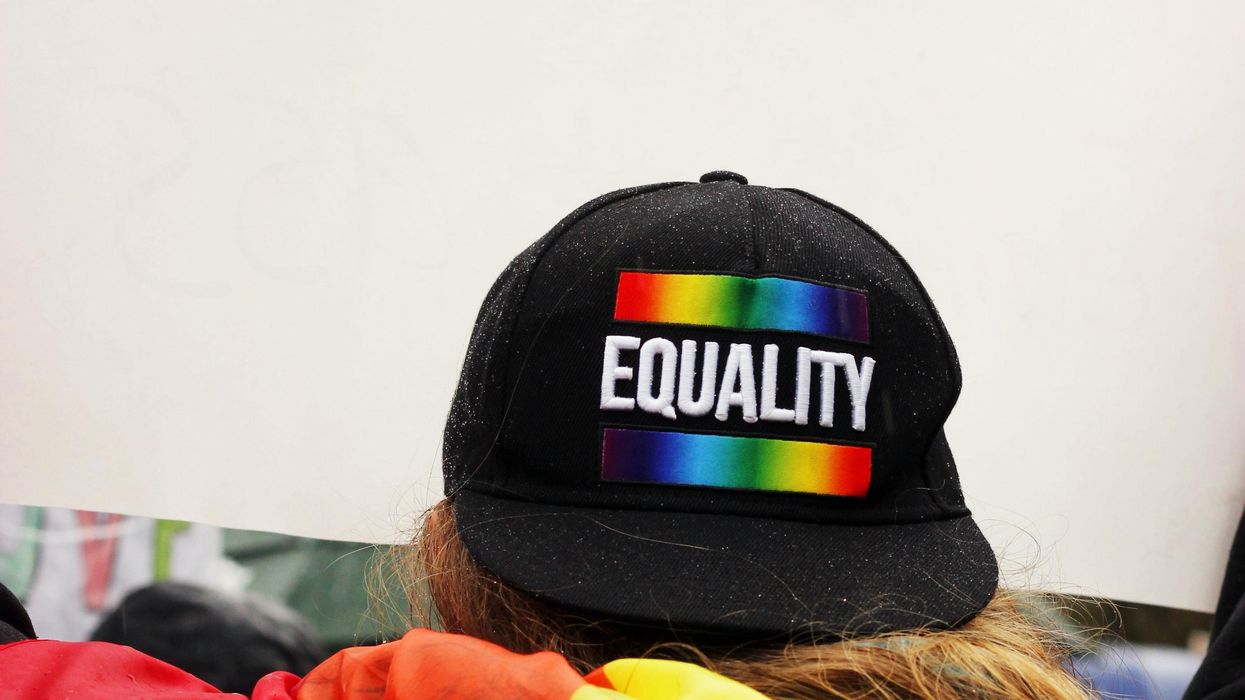 Person wearing a Pride Equality cap