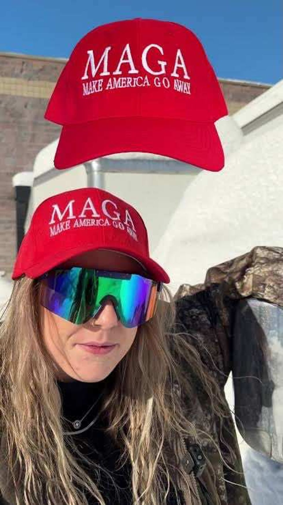 Person wearing "Make America Go Away" hat