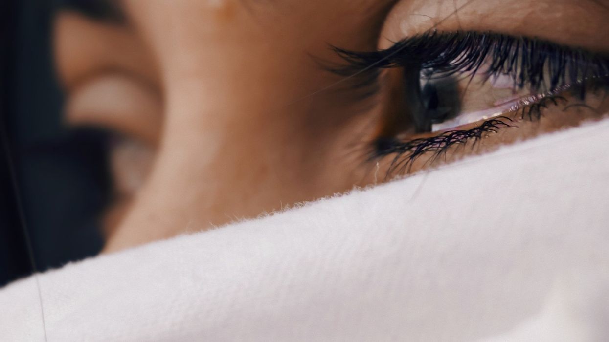 Person with eyes tearing up