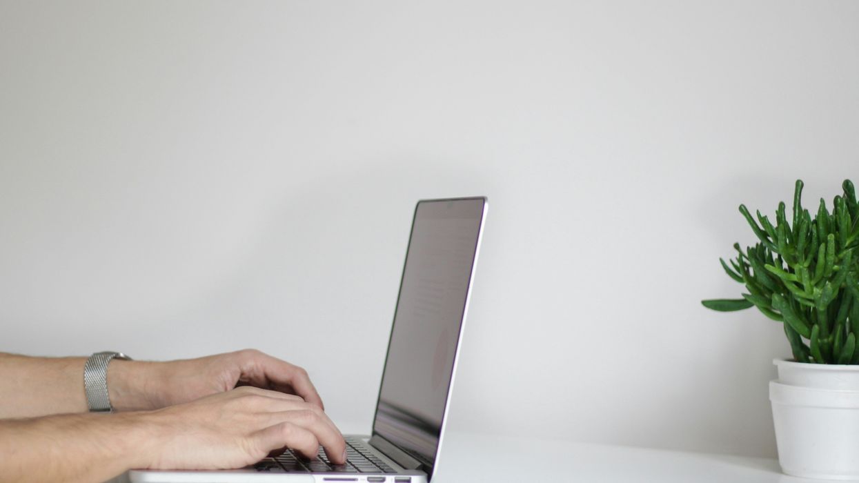 Person with laptop open at work