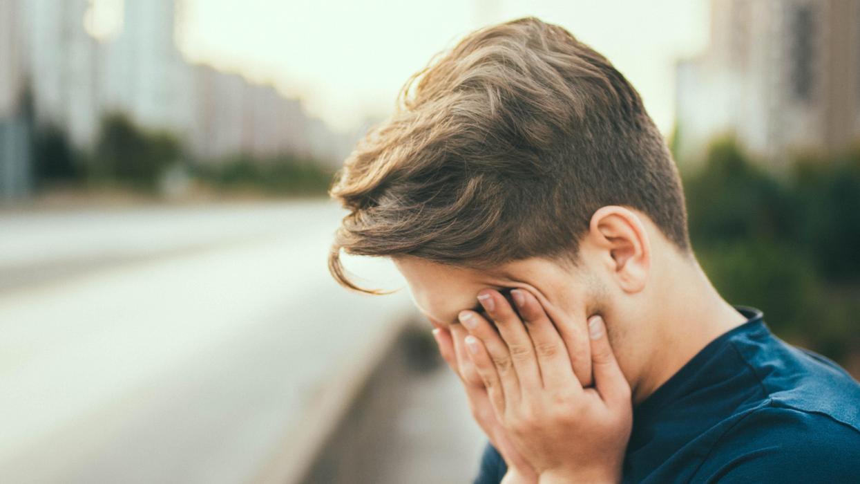 person with their head in their hands