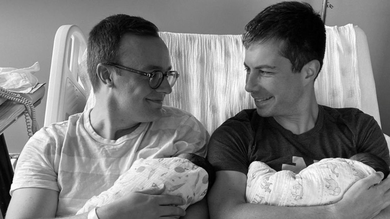 Pete and Chasten Buttigieg holding their twin babies
