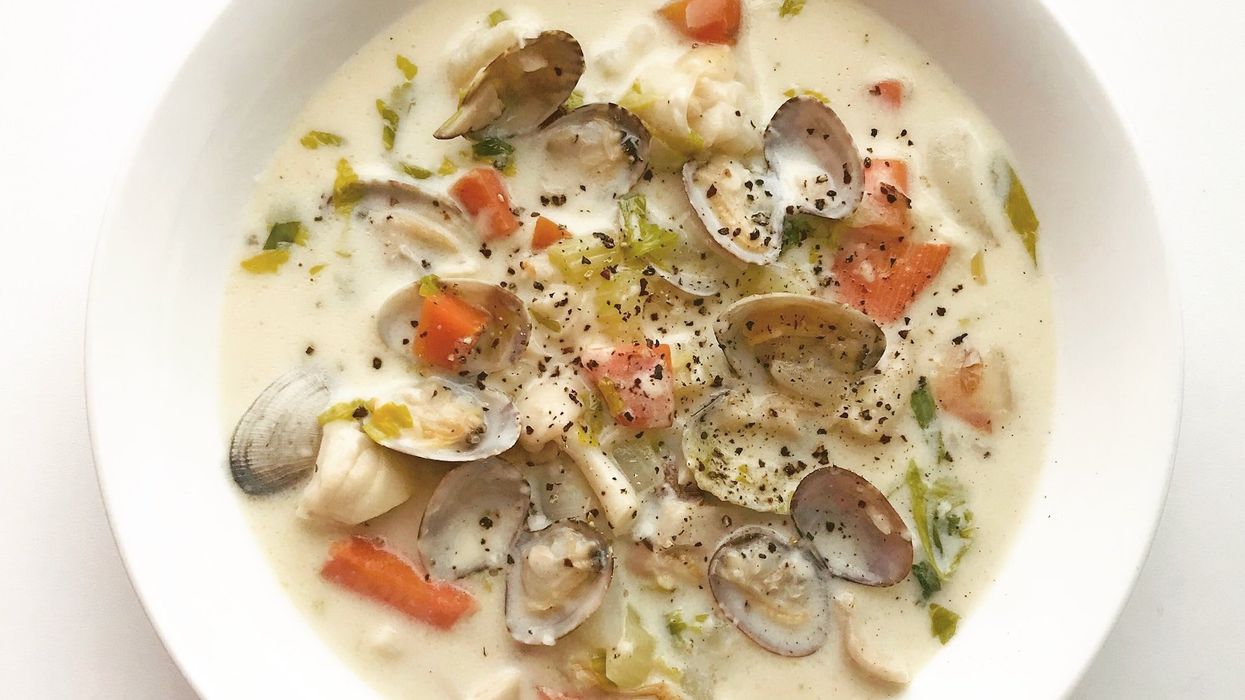 Photo of a bowl of clams, oysters and vegetables in a cream sauce