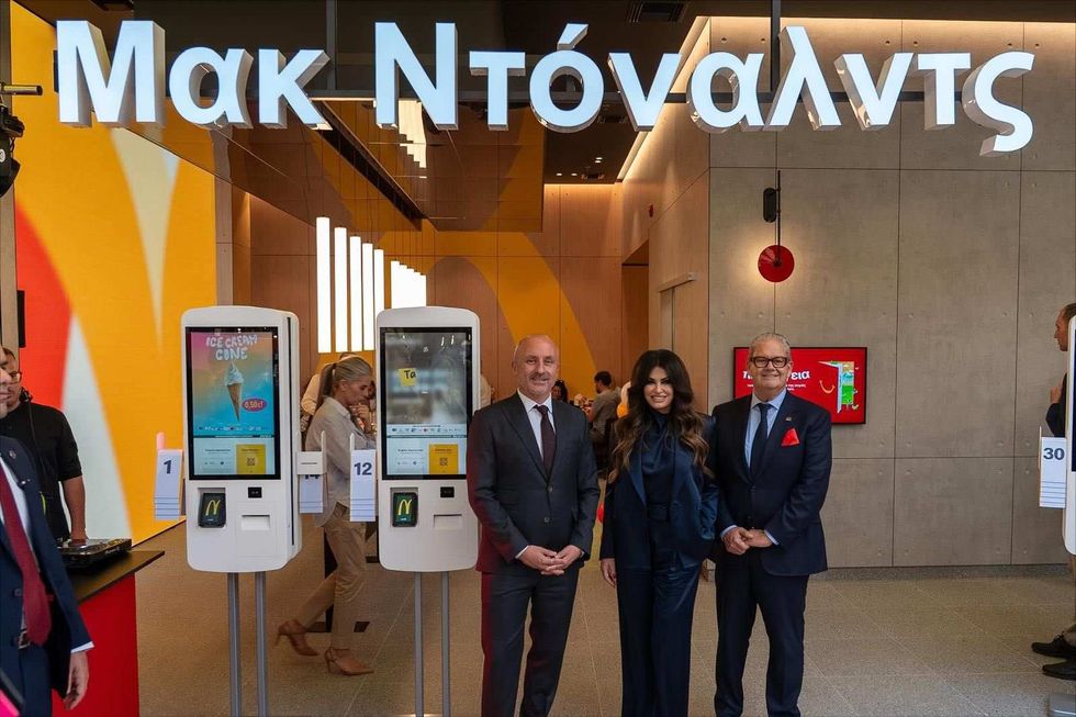 Photo of Kimberly Guilfoyle and officials at McDonald's ribbon-cutting ceremony