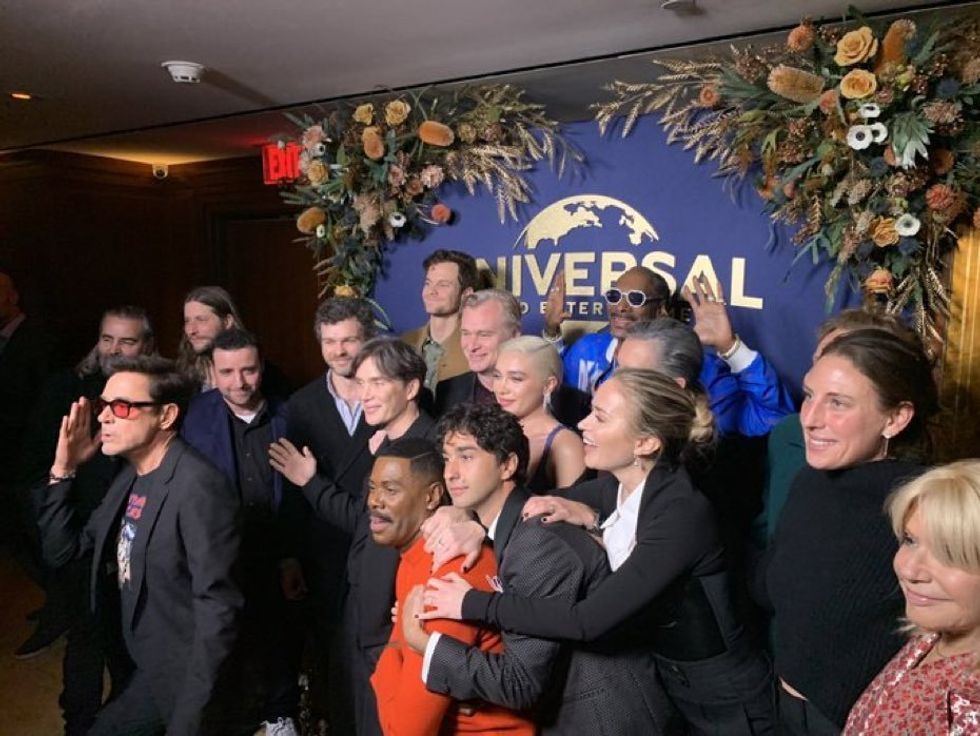 Photo showing Snoop Dogg photobombing the "Oppenheimer" cast