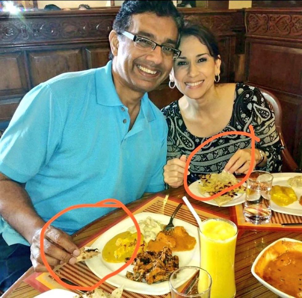 Picture of Dinesh D'Souza and his daughter eating with their hands