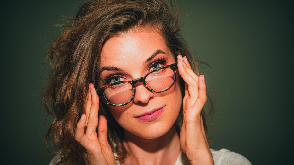 portrait of woman wearing eyeglasses with black frames