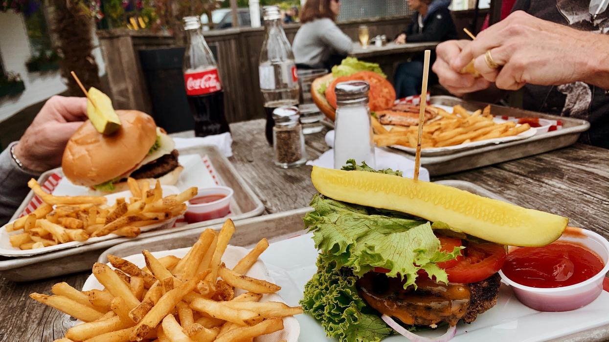 potato fries near burger with cabbage beside ketchup