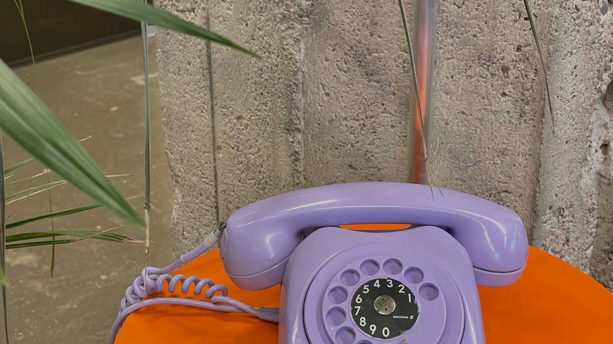 purple phone sitting on top of an orange table