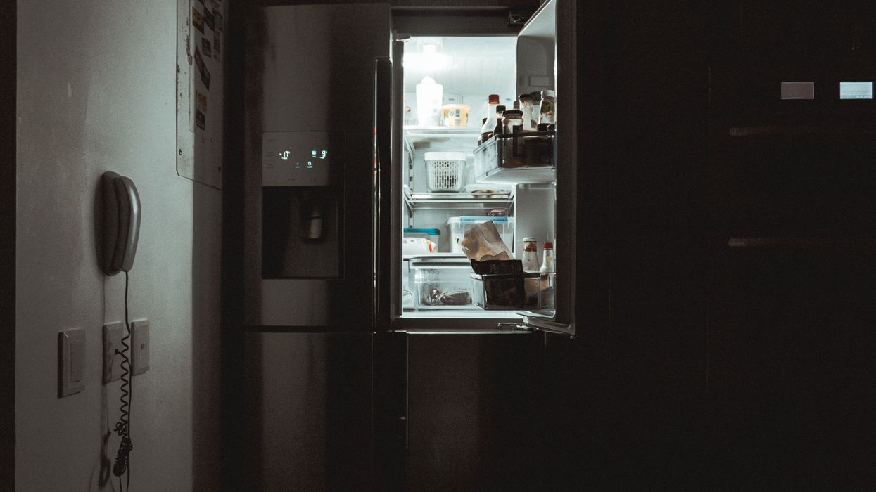 Refrigerator door left open at nighttime