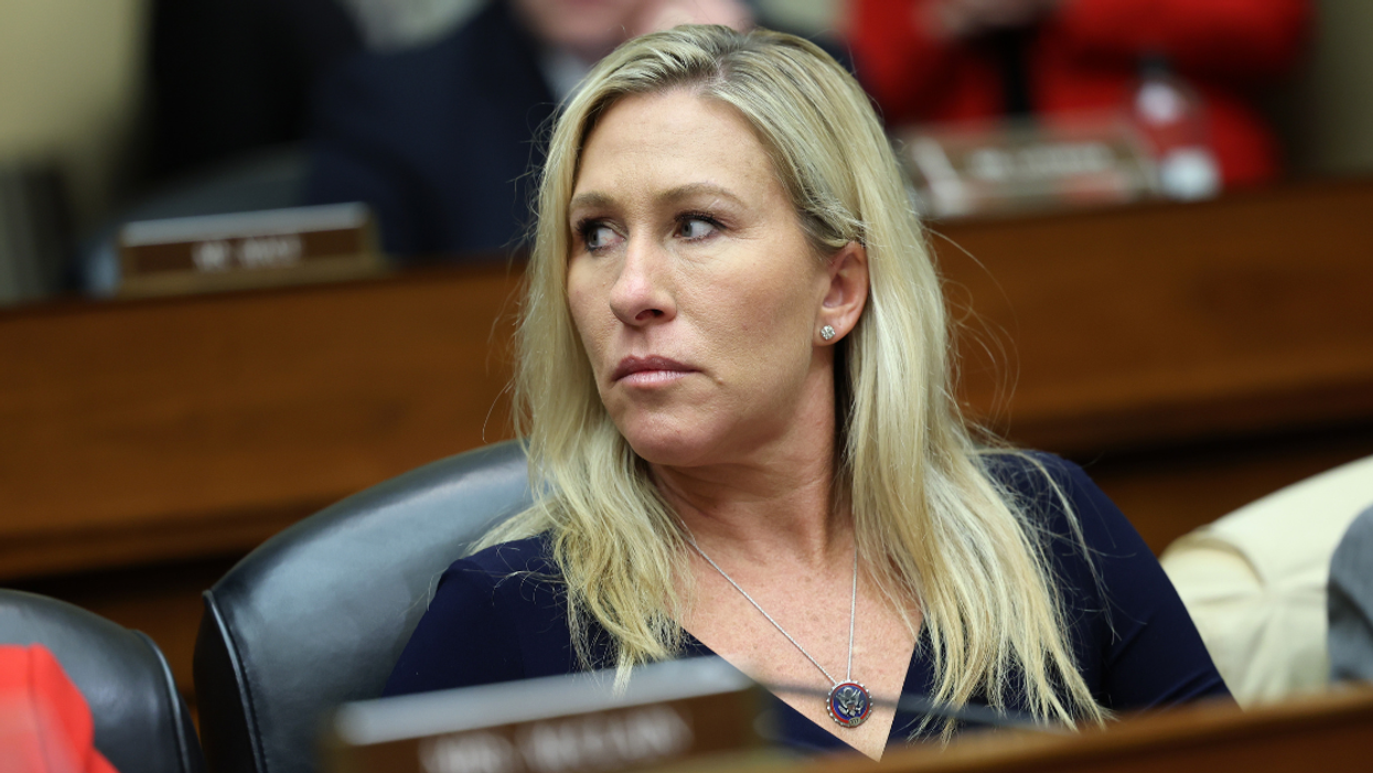 Representative Marjorie Taylor Greene sits in her seat in the House of Representatives