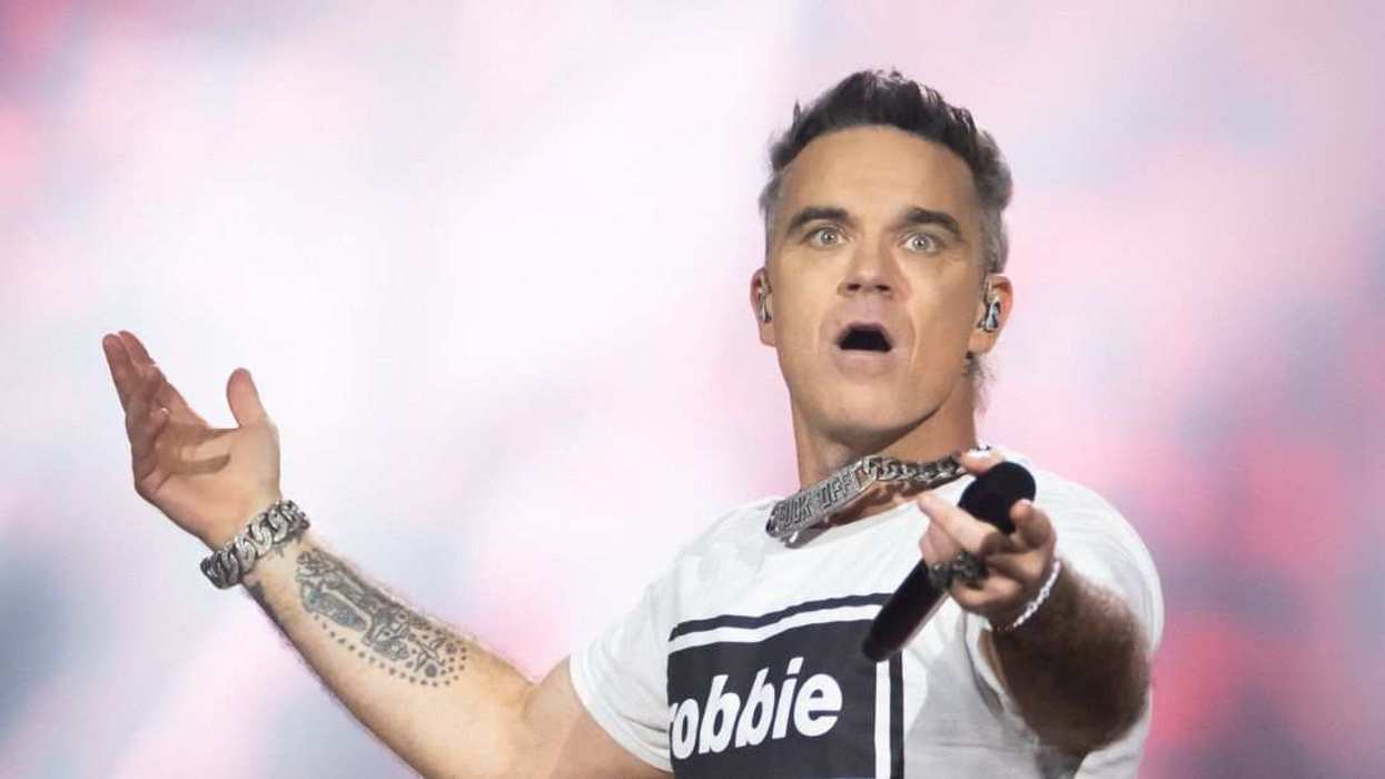 Robbie Williams performs live onstage during the Robbie Williams: Britpop tour.