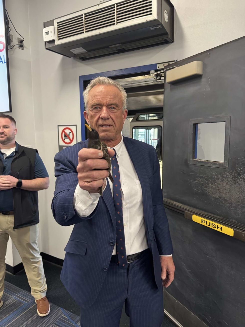 Robert F. Kennedy Jr. holding a starling