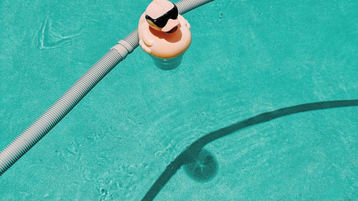 Rubber duckie with sunglasses in a pool