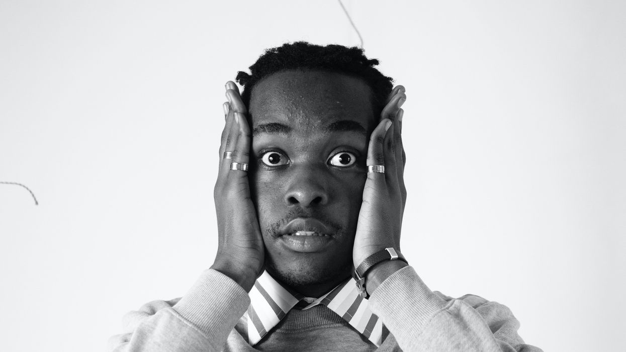 Scared man holding his face