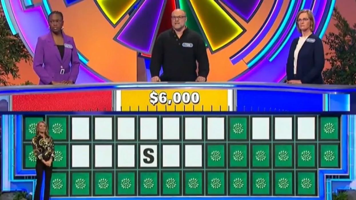 Screenshot from a "Wheel of Fortune" board with the letter "S" in a blank three-word phrase