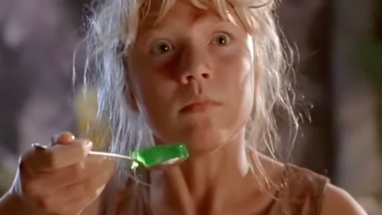 Screenshot from the movie Jurassic Park of character Lex Murphy holding a shaking spoonful of green Jello and looking frightened