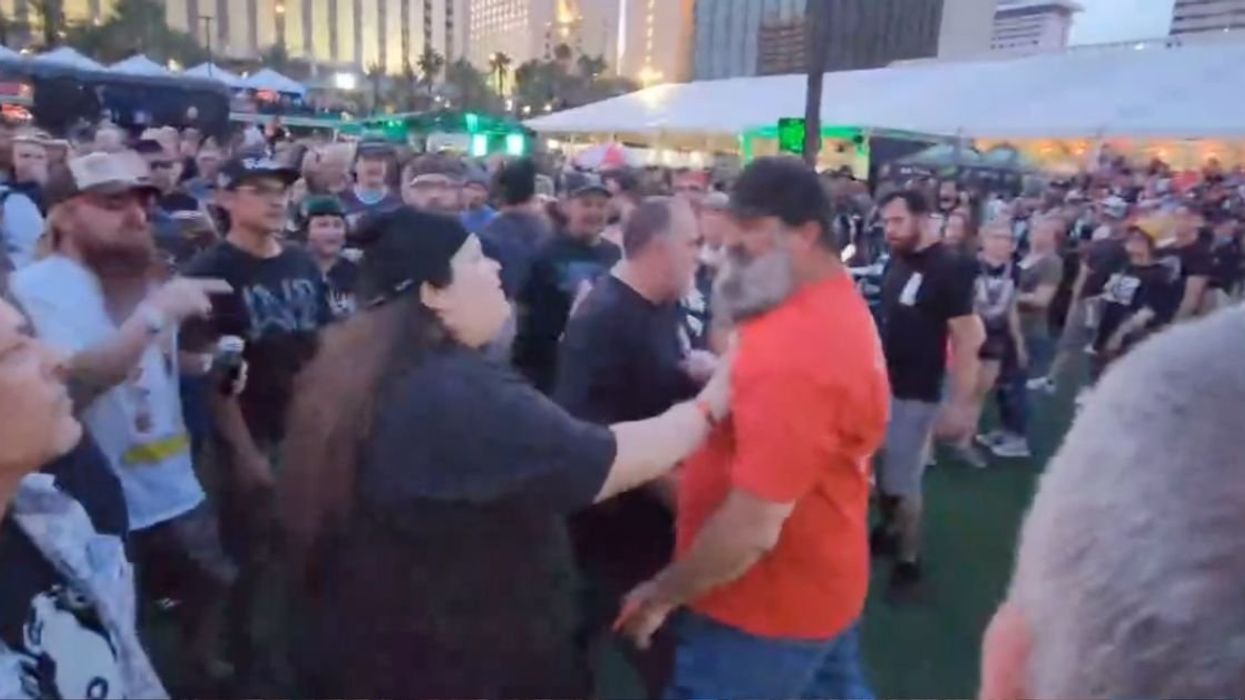 Screenshot from video of man in Nazi shirt at punk festival